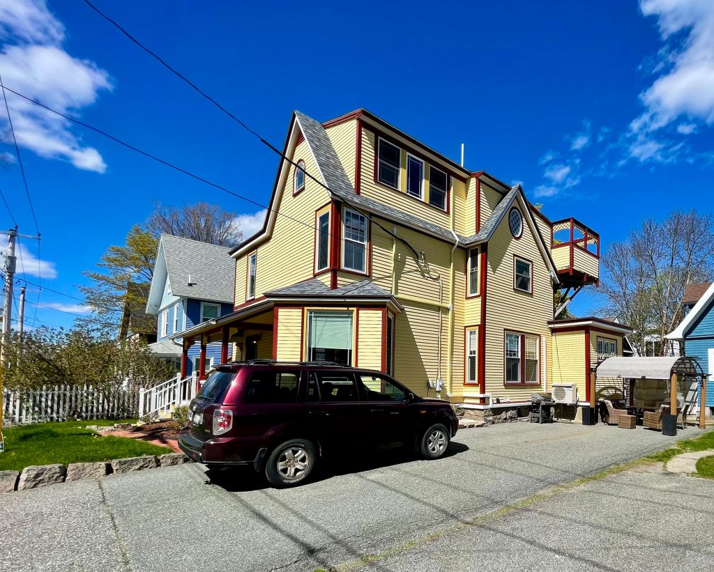 Side of cottage/parking area
